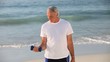 Senior man working his muscles with dumbbells