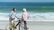 Senior couple with bikes talking each other