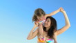 Video: Mother carrying her daughter on her shoulders Mother carrying her daughter on her shoulders