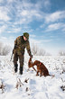 Hunter getting the pheasant from the dog Hunter getting the pheasant from the dog