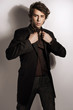 Fashionable man posing in elegant clothes Fashionable man posing in elegant clothes