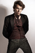 Fashionable man posing in elegant clothes Fashionable man posing in elegant clothes