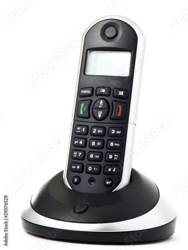 Photo: Wireless telephone with cradle isolated on white background Wireless telephone with cradle isolated on white background