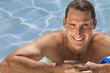Handsome Middle Aged Man Relaxing In Swimming Pool