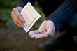 A man pouring seeds into his hand