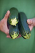 A man holding courgettes