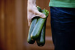 A man holding courgettes