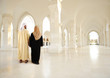 Muslim arabic couple inside big oriental empty modern building