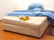 Mattress with sheets and pillows