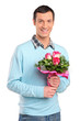 Young smiling man holding a bouquet of flowers