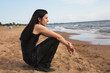 man with long hair on the beach