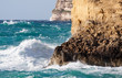 Sea wave breaking against  cliff