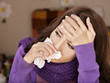 Young woman with handkerchief having  cold.