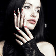 Beautiful woman with long, designer nails