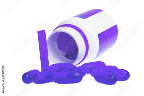 Photo: Capsules on white background Capsules on white background
