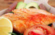 hot baked salmon piece served with vegetables