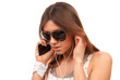 fashion spy woman in sunglasses talking on mobile cellphone