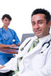 Photo: Nurse assisting doctor in hospital Nurse assisting doctor in hospital