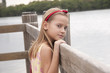 Photo: girl is on bridge and looks directly in a camera girl is on bridge and looks directly in a camera