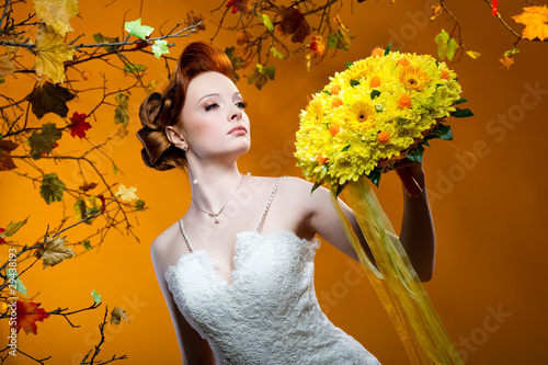 Photo: Beautiful redhead bride with a bouquet of flowers Beautiful redhead bride with a bouquet of flowers