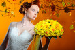 Photo: Lovely redhead bride with a bouquet of flowers Lovely redhead bride with a bouquet of flowers