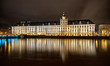 Night view on big building and river