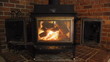 Wood stove Fireplace against brick wall