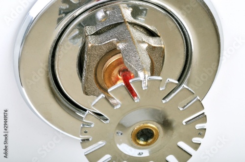 Photo: Close up image of fire sprinkler on white. Close up image of fire sprinkler on white.