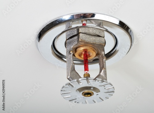 Photo: Close up image of fire sprinkler on white. Close up image of fire sprinkler on white.