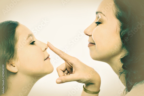 Photo: Mother and daughter playful portrait Mother and daughter playful portrait