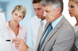 사진:Mature man making a business presentation to a group Mature man making a business presentation to a group