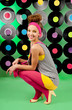 studio shot of cheerful teenage girl over colorful background