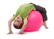Little boy doing gymnastic exercises