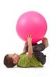 Little boy doing gymnastic exercises Little boy doing gymnastic exercises