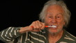 Senior Brushes teeth