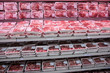 Fully loaded shelves with meat in large supermarket Fully loaded shelves with meat in large supermarket
