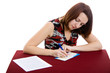 portrait of beautiful brown-haired girl writing address