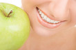 healthy teeth and green apple