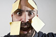 disparate man with postit on his face