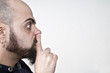 man with his finger in the nose