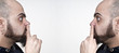 men with their fingers in their nose