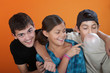 Photo: Young girl Touching a bubble from her brothers chewing gum Young girl Touching a bubble from her brothers chewing gum