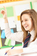 Photo: Teenage Female Student Answering Question In Classroom Teenage Female Student Answering Question In Classroom