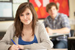 Photo: Female Teenage Student Studying In Classroom Female Teenage Student Studying In Classroom