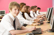 Teenage Students In IT Class Using Computers In Classroom