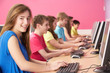 Teenage Students In IT Class Using Computers In Classroom