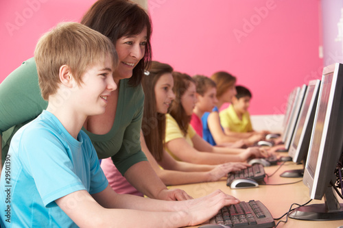 Photo: Teenage Students In IT Class Using Computers In Classroom With T Teenage Students In IT Class Using Computers In Classroom With T