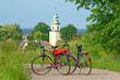 Two bikes standing on the road
