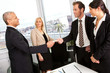 Business people exchange business cards