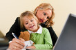 Photo: Businesswoman and mother is working at home Businesswoman and mother is working at home